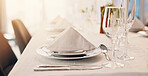 Plate, napkin and glasses on table at party for celebration, social event and gathering. Fine dining, luxury and decoration, setting and design for gala, new years eve and dinner at restaurant