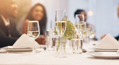 Buy stock photo Alcohol, champagne and table of people at party for celebration, social event and gathering. Glass, luxury and men and women with liquor for cheers, toast and drinks at gala, new years eve or wedding