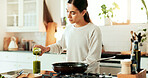 Woman, juice and cooking as chef for diet or recipe in home or kitchen with ingredients. Female person, frying pan and gourmet cuisine as creative or nutritionist for meal preparation, dinner or food