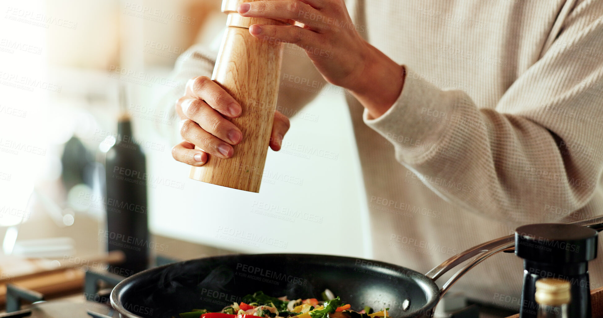 Buy stock photo Hands, person and cooking with spices in kitchen for salt seasoning, flavor and healthy meal prep in home. Frying pan, chef and food ingredients for lunch, vegetables or dinner for nutrition by stove