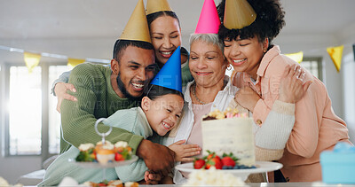 Buy stock photo Hug, birthday and senior woman with family in home for party, celebration or fun event together. Happy, wishes and people embracing elderly female person for bonding, love and care with cake at house