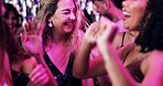 Dancing, celebration and friends in club, night and fun for women, bonding and smile in weekend or group. Lights, dark and listening to music, dancer and people in rave, disco or festival in New Year