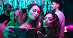 Kiss, selfie and friends in club, night and group of women, bonding and celebration in weekend and smile. Photography, dark and memory of party, event and profile picture of people, rave and New Year