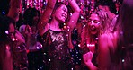 Women, dancing and glitter in night club for party, celebration and excited for New Year. Friends, movement and energy on dancefloor for event, disco or birthday social with neon lights for aesthetic