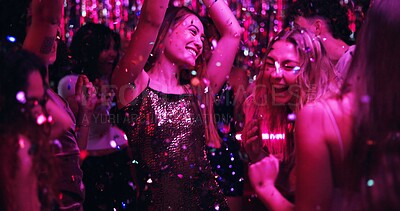 Buy stock photo Women, dancing and glitter in night club for party, celebration and excited for New Year. Friends, movement and energy on dancefloor for event, disco or birthday social with neon lights for aesthetic