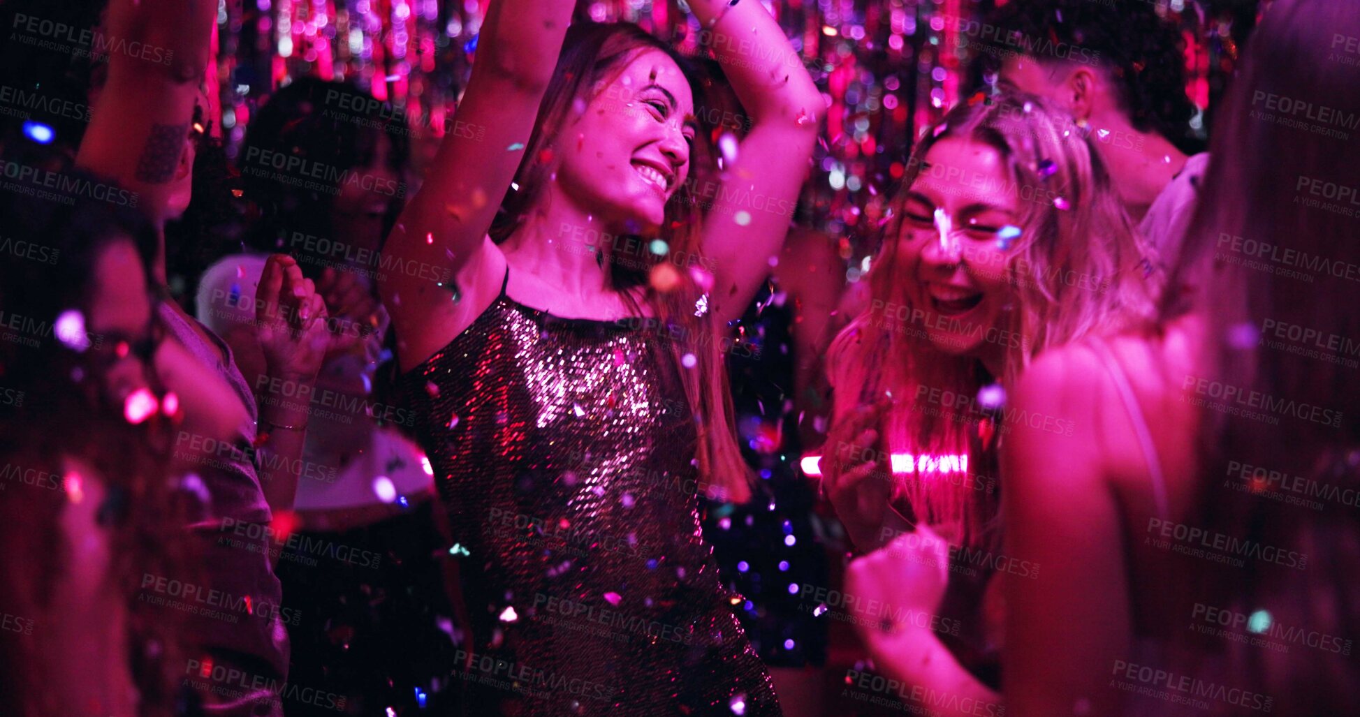 Buy stock photo Women, dancing and glitter in night club for party, celebration and excited for New Year. Friends, movement and energy on dancefloor for event, disco or birthday social with neon lights for aesthetic