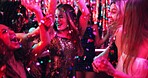 Women, dance and glitter in night club for party, celebration and excited for New Year. Friends, movement and energy on dancefloor for event, disco or birthday social with neon lights for aesthetic