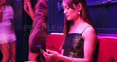 Buy stock photo Cellphone, nightclub and woman relax with texting for online breakup with toxic relationship. Unhappy, bored and female person on sofa with phone for networking on dating app at party for meeting.