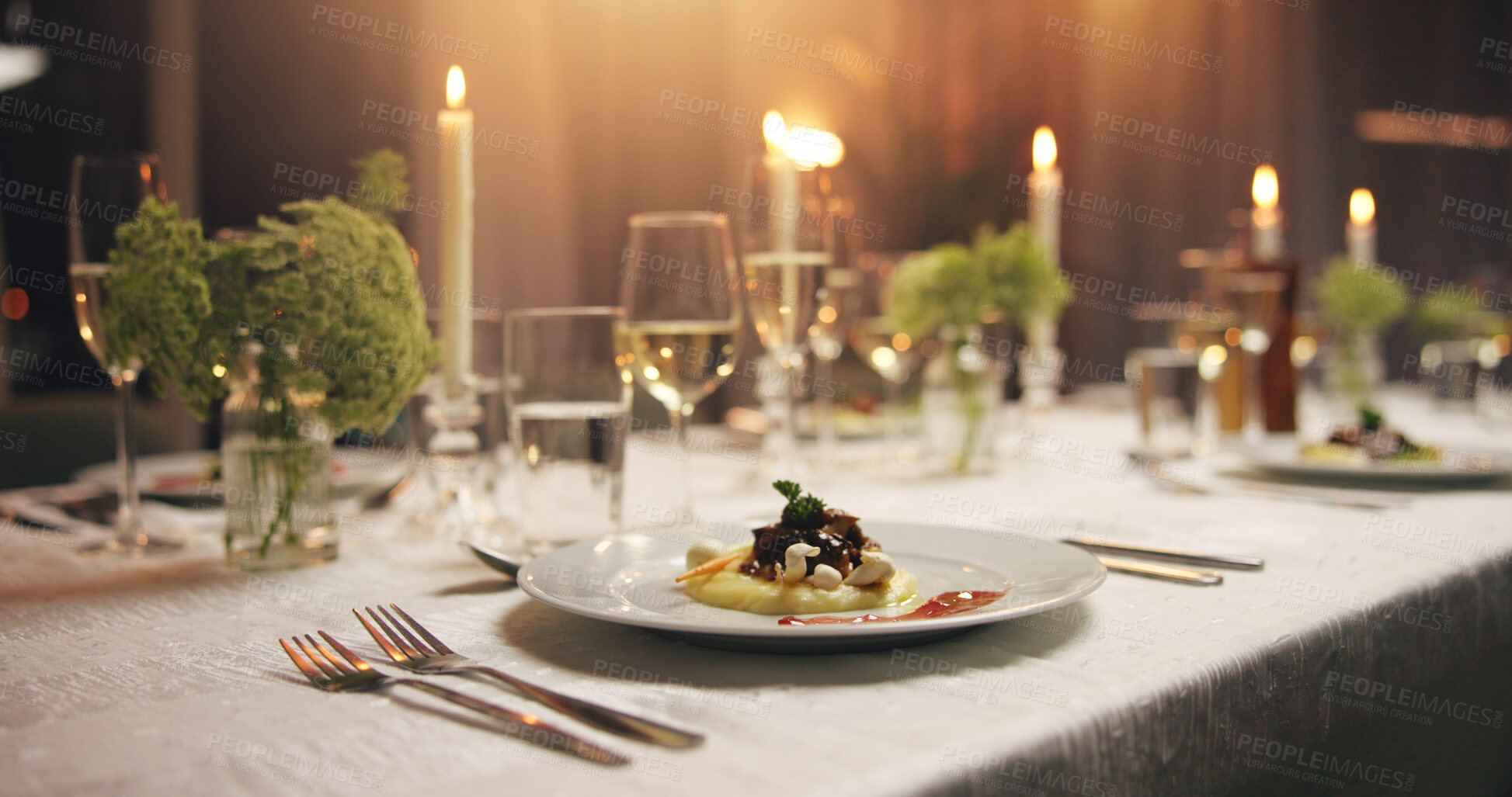 Buy stock photo Plate, food and empty dinner table at event with catering, candles and service for gala at night. Meal, party and glass for water, alcohol or drinks with luxury, interior or furniture for fine dining