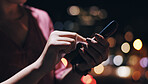 Night, phone and hands of businesswoman on rooftop of office building with research for investment. Tech, closeup and female financial planner typing email on cellphone for profit dividend report.