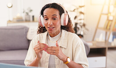 Buy stock photo Woman, headphones and laptop for video call in home, remote worker and internet for communication. Mature female person, freelancer and virtual conference for team meeting, talking and collaboration