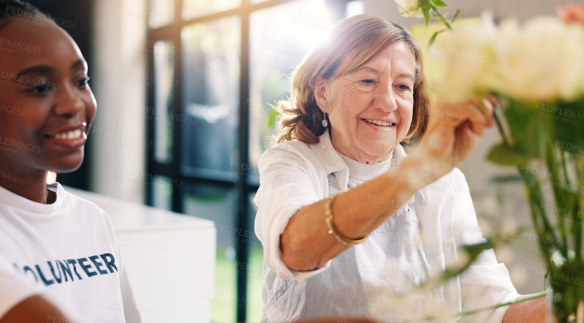 Buy stock photo Senior care, elderly woman and volunteer in nursing home for help, support or enrichment with activity. Retired person, girl or happy with flowers for bonding, outreach programme or community service