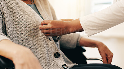 Buy stock photo Dressing, caregiver and senior person with disability for helping, support and comfort in retirement. Hands, patient and nurse by closeup for assistance, health wellness and woman in wheelchair