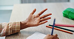 Hands, education and child in classroom, counting and writing of homework, notebook and learning of math. Back to school, growth and development of kid, studying and numbers for test and knowledge