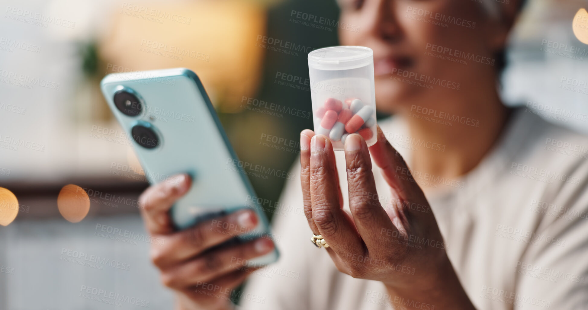 Buy stock photo Hands, medicine and phone with woman in home to search for directions, dosage or side effects. Container, healthcare and medical with person in apartment, reading information on mobile for pills