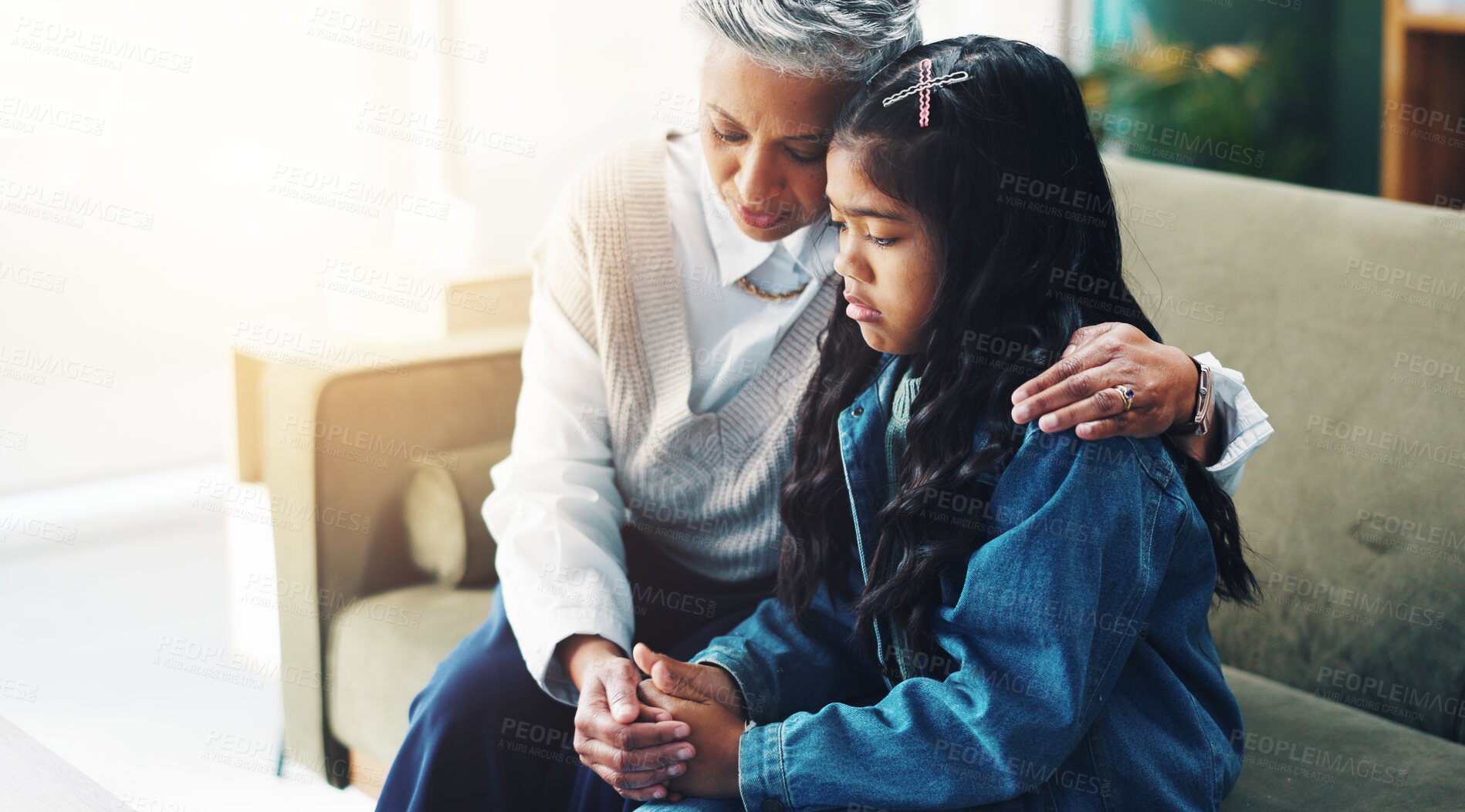 Buy stock photo Holding hands, therapist and sad girl child in consultation for support, trust and professional care at pediatric clinic. Hug, psychologist and kid in counseling with stress, anxiety or mental health