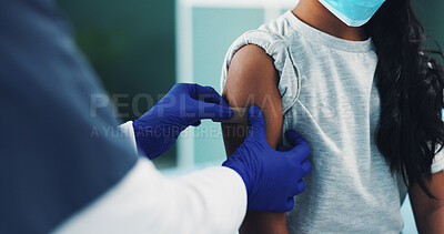 Buy stock photo Hands, child and nurse with bandage for vaccine, safety and mpox prevention closeup in pediatric hospital. Girl, medical doctor and apply plaster on arm for protection, virus immunity and healthcare