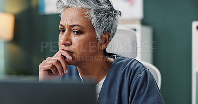Buy stock photo Doctor, thinking and mature woman by laptop in office for healthcare, research or online patient records. Medical professional, reading and work with technology for treatment, information or solution