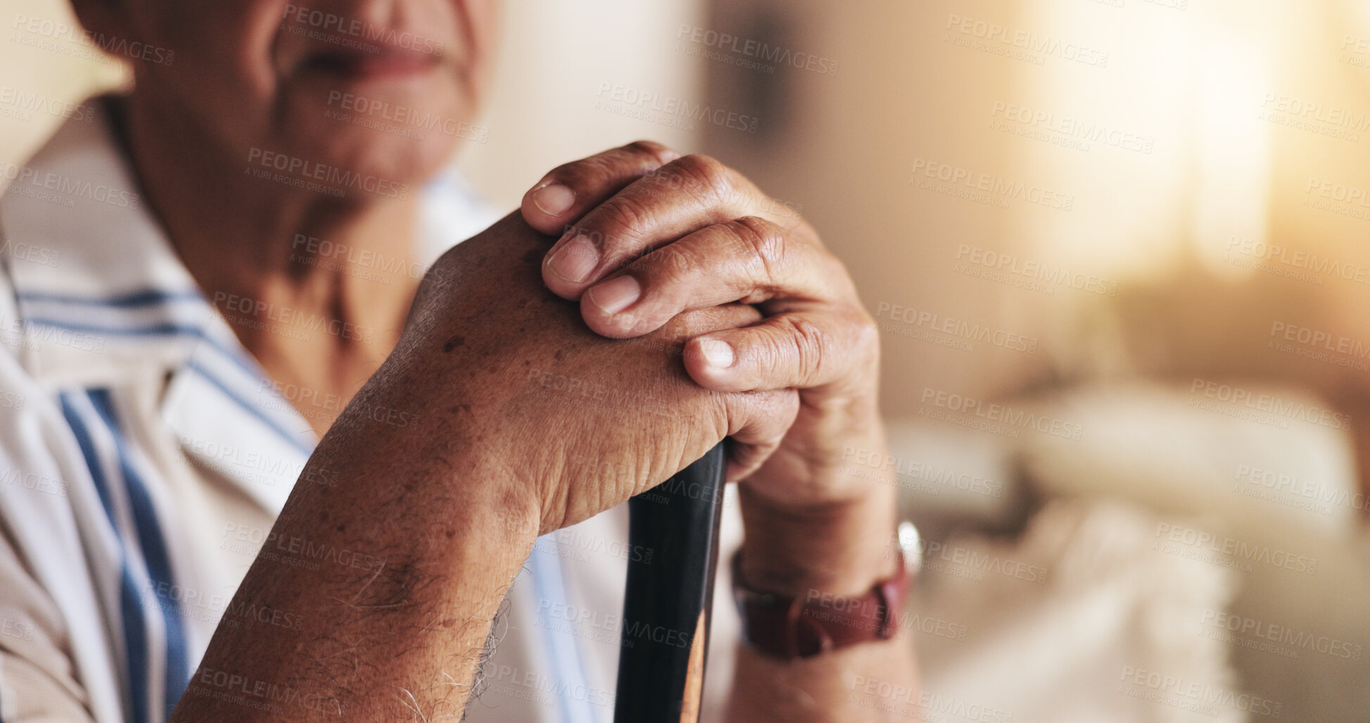 Buy stock photo Senior, man and hands with walking stick in home for mobility support, alzheimer or rehabilitation. Elderly male, closeup or cane on sofa for balance, dementia or person with disability in retirement