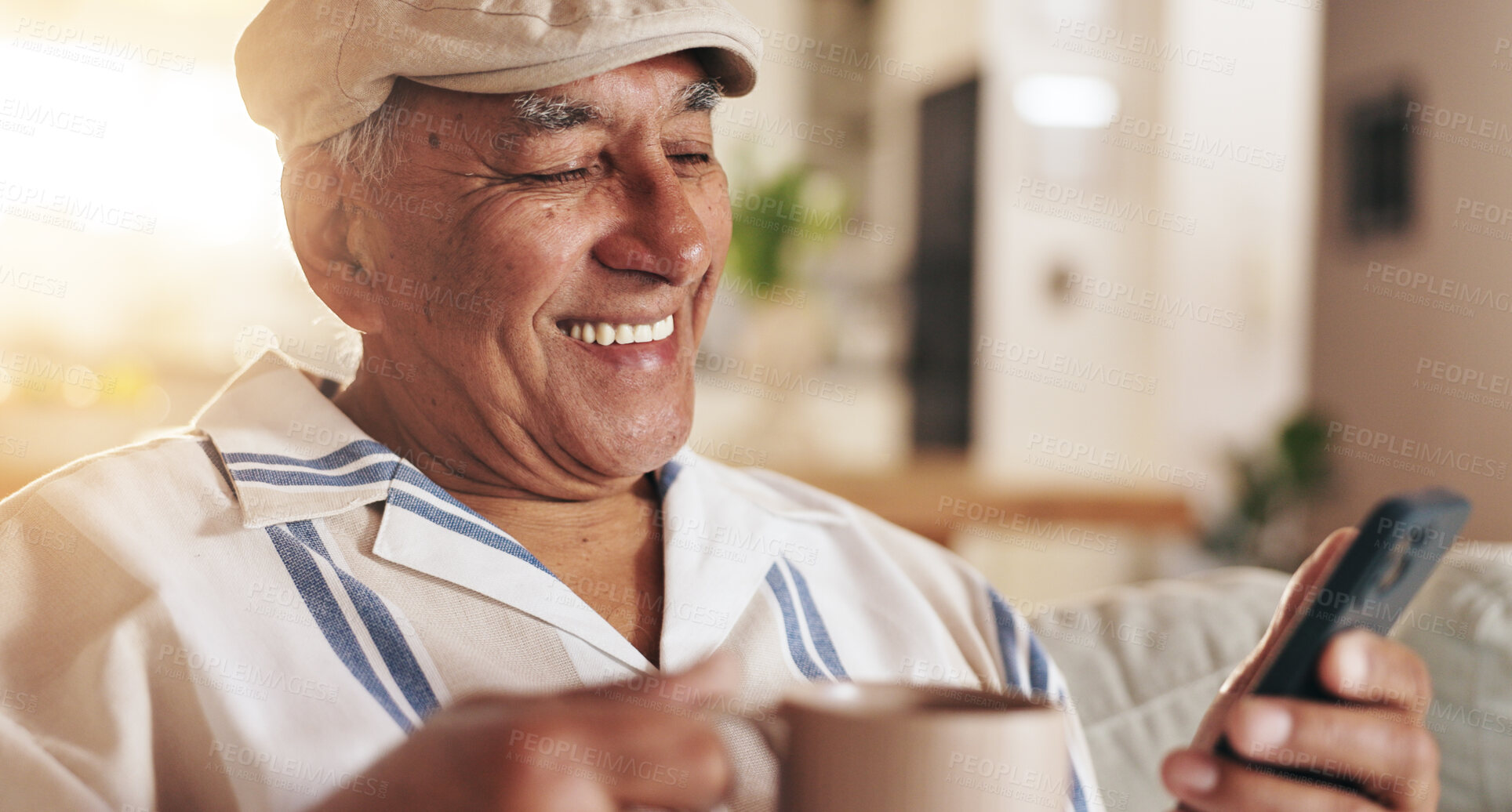 Buy stock photo Senior man, phone text and coffee in home with retirement, relax and morning scroll with online game. Tea, calm and digital news app with reading, mobile and tech in living room with latte and smile