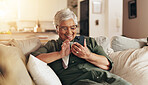 Old woman, relax and phone for communication in home, reading notification and texting on app. Female person, senior lady and couch for scroll on social media, funny ebook and website for news update