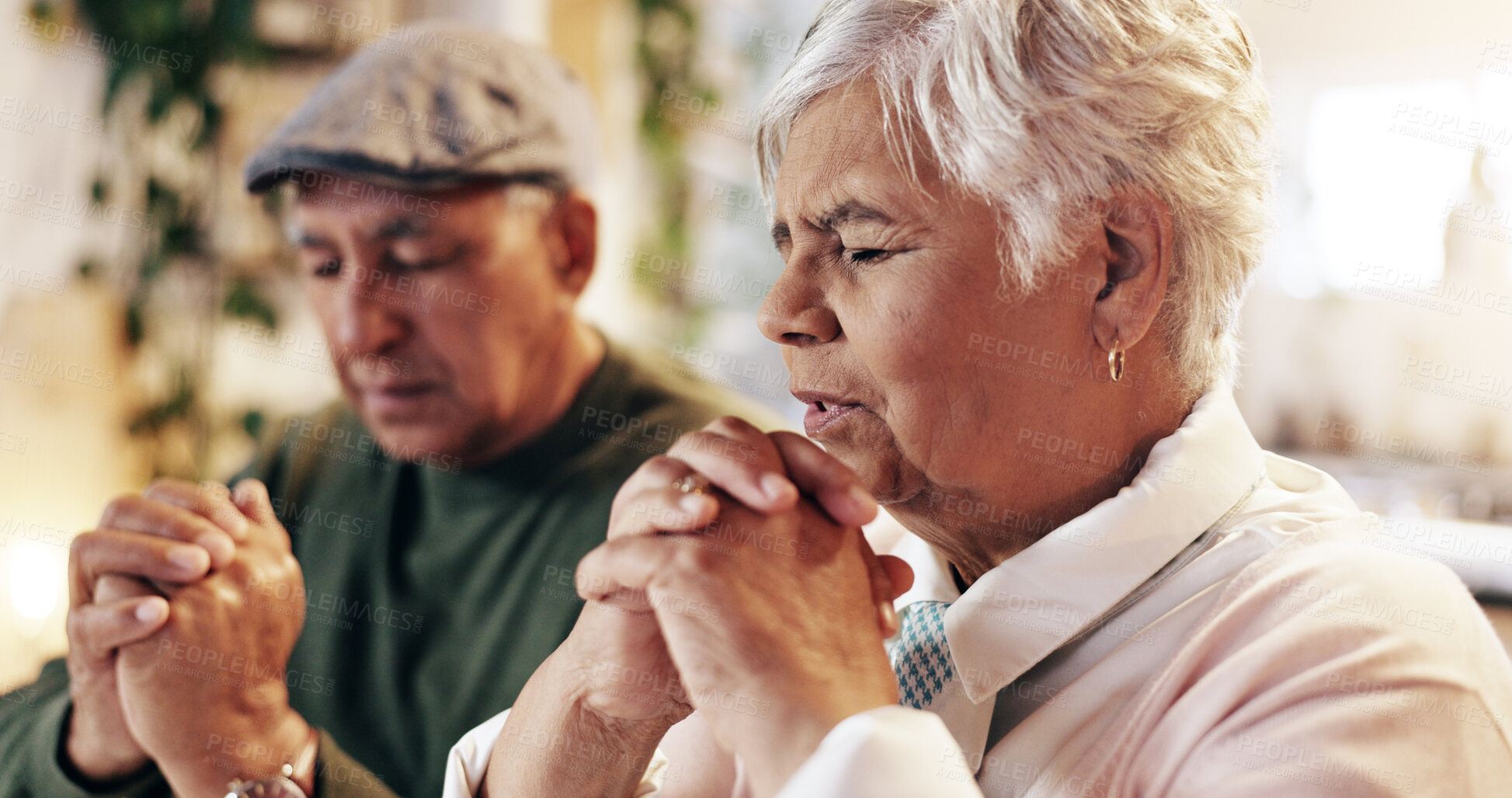 Buy stock photo Retirement, praying and couple with faith, home and respect for God, worship and gratitude for holy spirit. Christian, old man and woman with praise to Jesus, talking and peace with belief and heaven