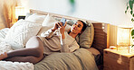 Phone, rest and woman on bed in home with social networking, browsing and swiping on dating app. Calm, relax and female person laying in bedroom with cellphone for reading online blog in apartment.