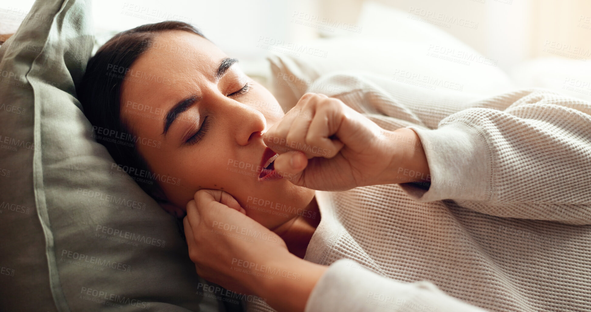 Buy stock photo Woman, coughing and sick in home, virus influenza and laying on bed with bacteria infection. Female person, flu symptoms and bedroom with sore throat or lungs disease, respiratory and chest illness