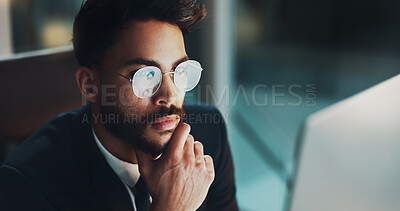 Buy stock photo Night, glasses and man in office with laptop, thinking or reflection for online project at digital agency. Research, overtime and businessman at desk reading email, report or business plan at startup