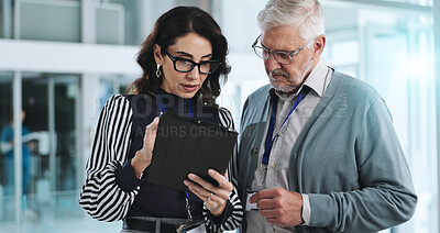 Buy stock photo People, tablet and meeting in clinic for healthcare, innovation and feedback with information. Mature hospital CEO, woman and tech in lobby with results, advice and professional opinion for medicare