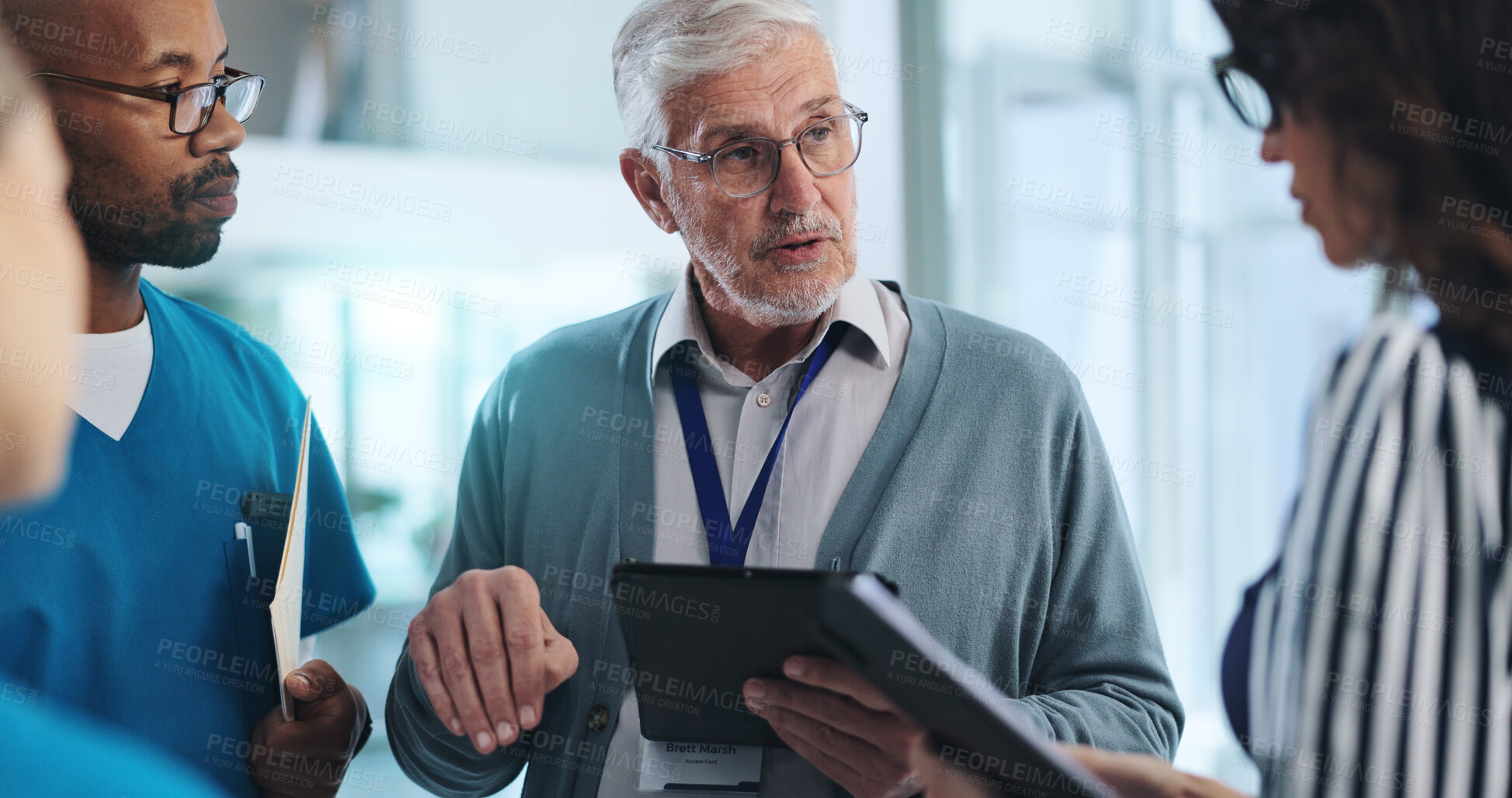 Buy stock photo Medical team, tablet and meeting in clinic with research, innovation and feedback for surgery. Mature hospital CEO, people or tech in lobby with results, advice or professional opinion for healthcare