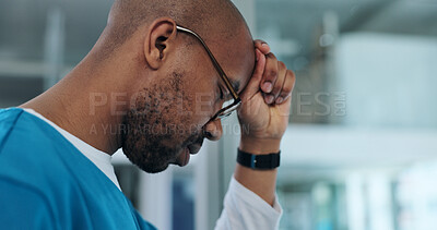 Buy stock photo Black man, doctor and stress in hospital for healthcare, mistake and regret in surgery. Surgeon, glasses and depression at window for crisis, overwhelmed and pressure with mental health awareness