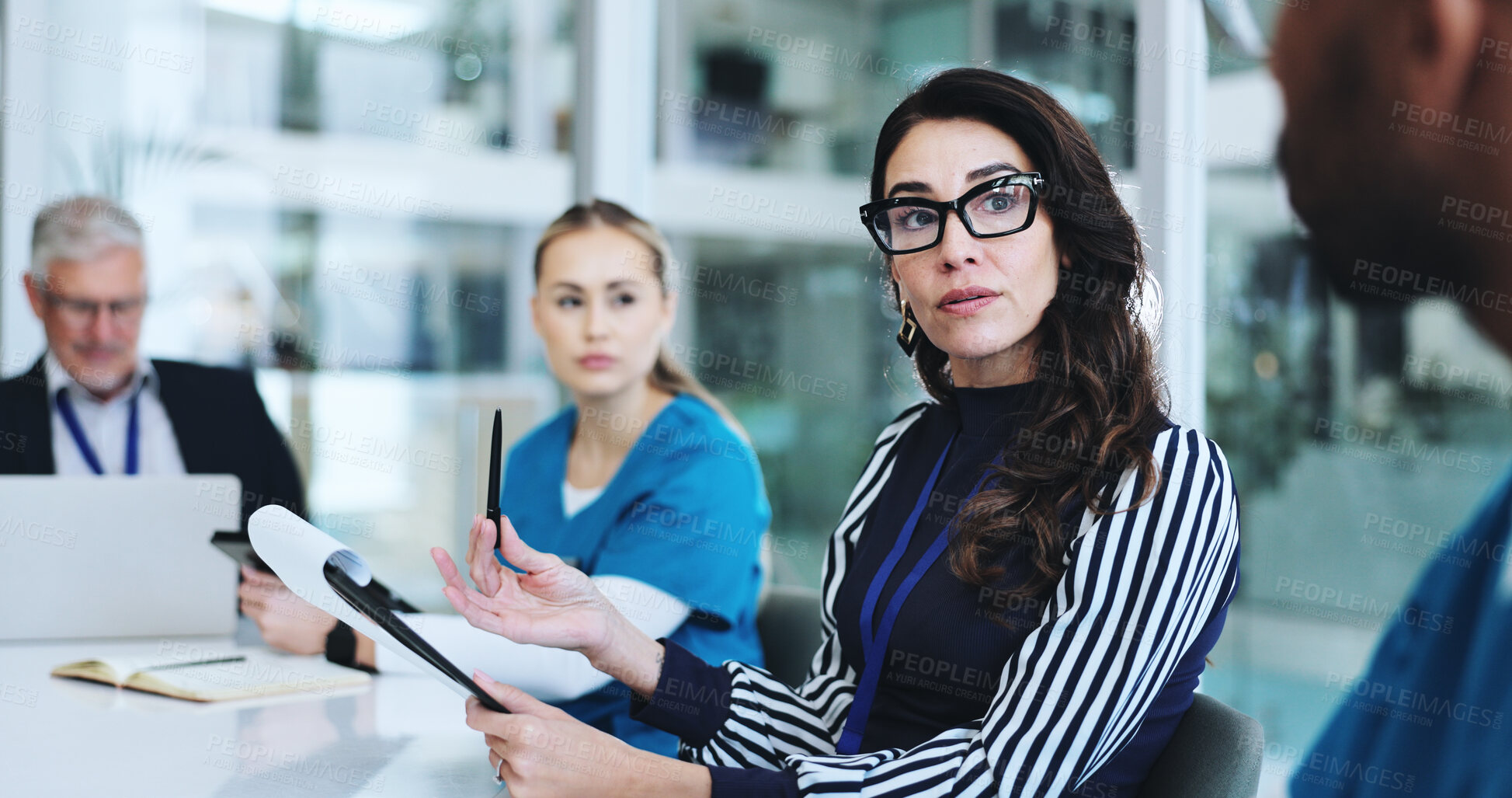 Buy stock photo Medical team, people and meeting at boardroom for report, results and progress on healthcare project. Hospital, coworking and employees in discussion with brainstorming, planning and strategy