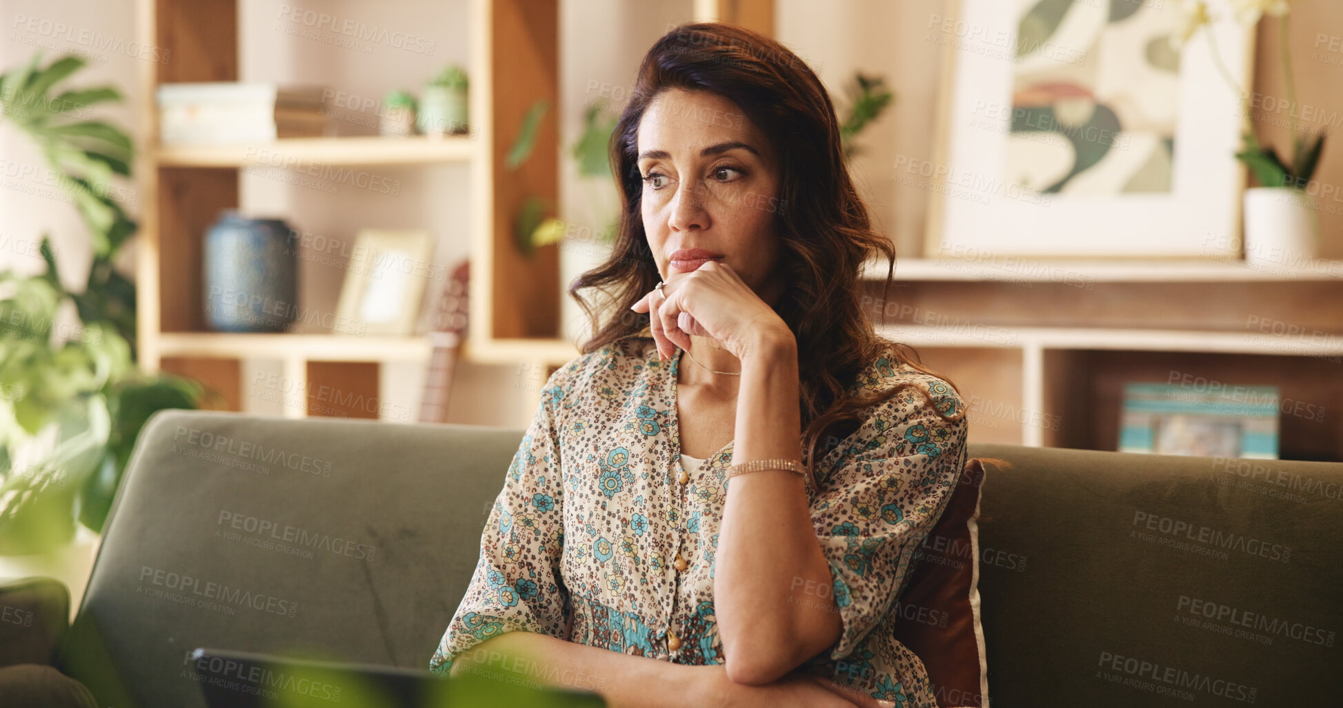 Buy stock photo Mature, woman and thinking on sofa with stress in home for financial crisis, recession news and worried. Person, thoughtful and reflection on couch in lounge with debt anxiety and depression in house