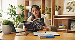 Student, reading and education with girl in home office for research assignment, college thesis and future. Book, knowledge and learning with person studying for university, school and project