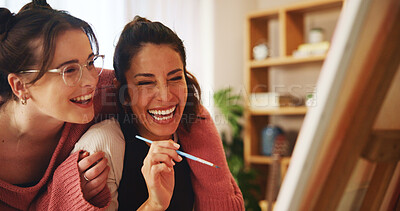 Buy stock photo Lesbian, couple and laughing with canvas in home for painting project, help and hobby on weekend. Happy, LGBTQ and women with hug by easel in house for love, support or discussion on creative artwork