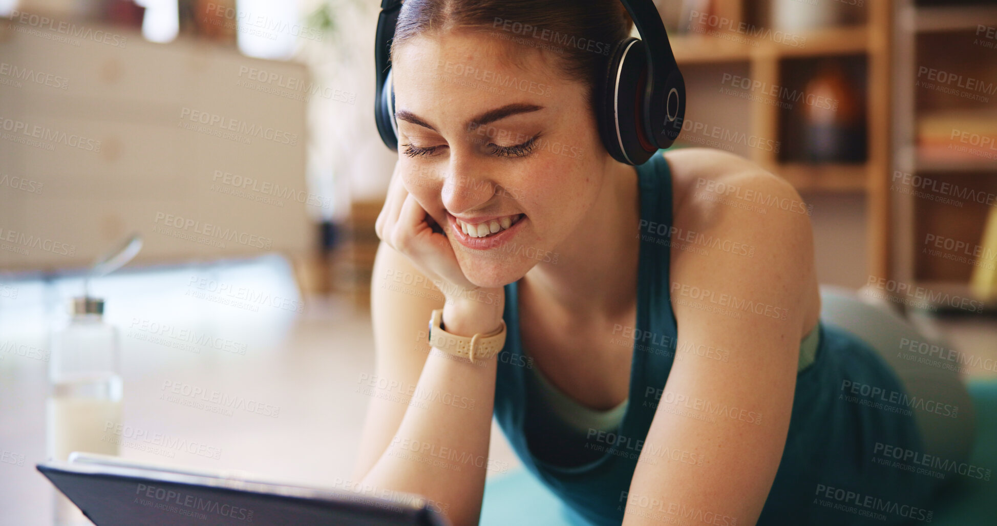 Buy stock photo Fitness, headphones and woman on tablet relax in home for wellness, health and workout for online class. Happy, music and person on floor on digital tech after exercise, yoga and watching videos