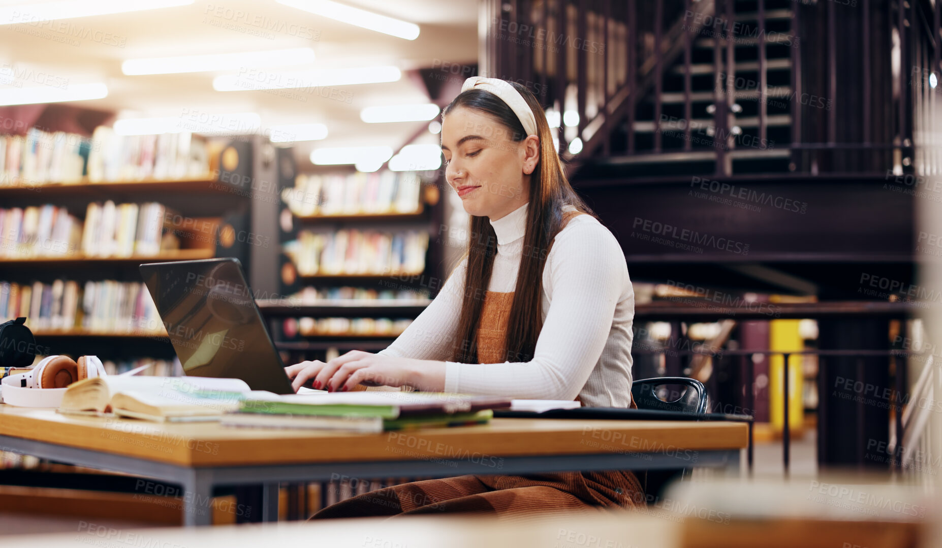 Buy stock photo Typing, laptop and research with woman in library for knowledge, education and college thesis. Academy, future and university with student and online portal for exam, project and scholarship