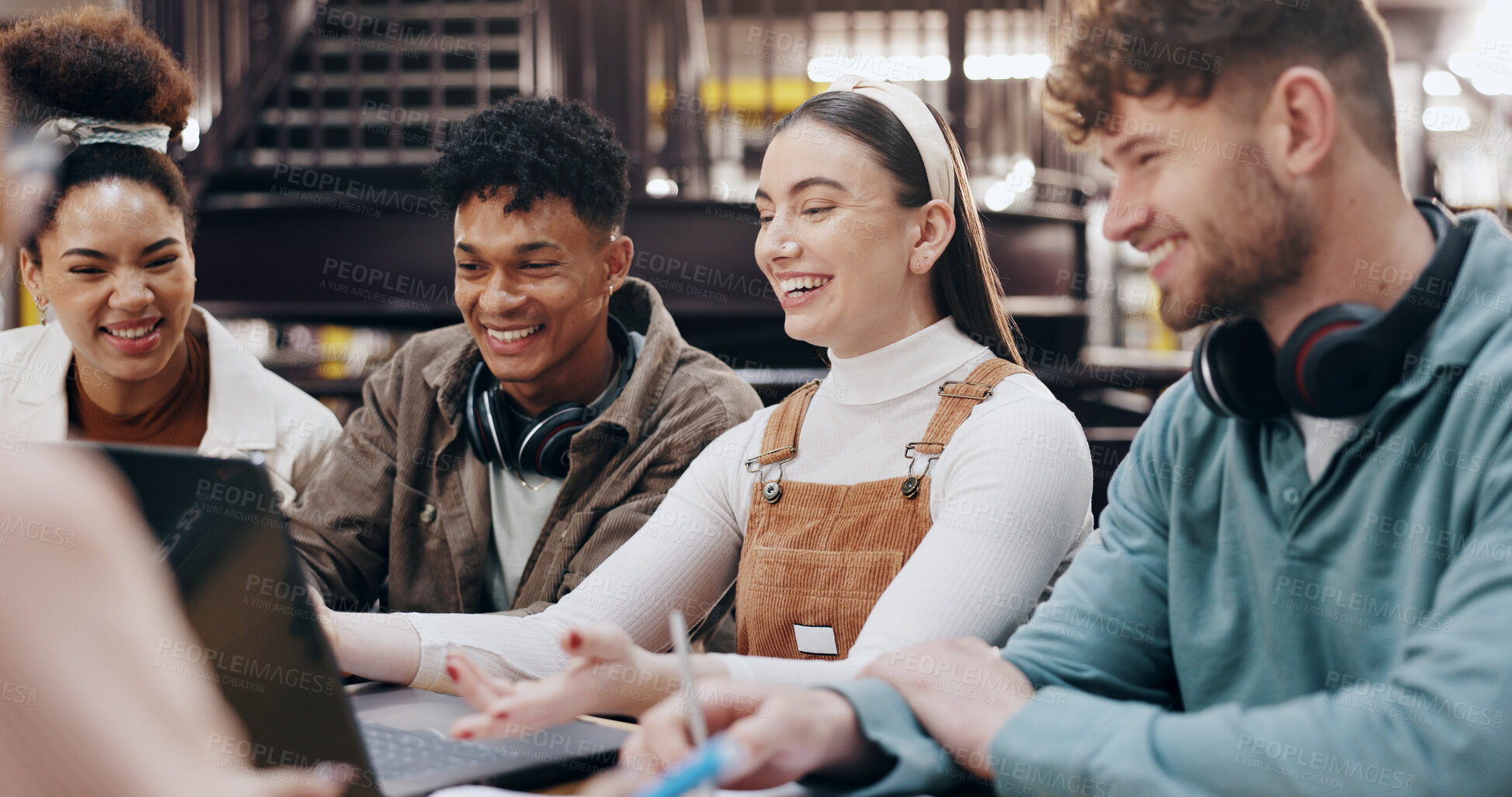 Buy stock photo Students, happy and laptop in library for education, funny media and research assignment. People, laugh and tech in university for social media post, comedy literature and excited for test results