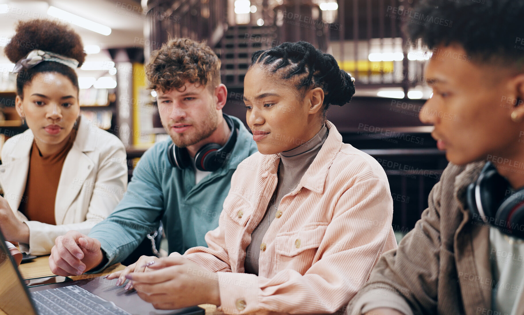 Buy stock photo People, university student and group work  with laptop at library for research, assignment and project. Classmates, friends and serious as college learner on campus for revision, studying or teamwork