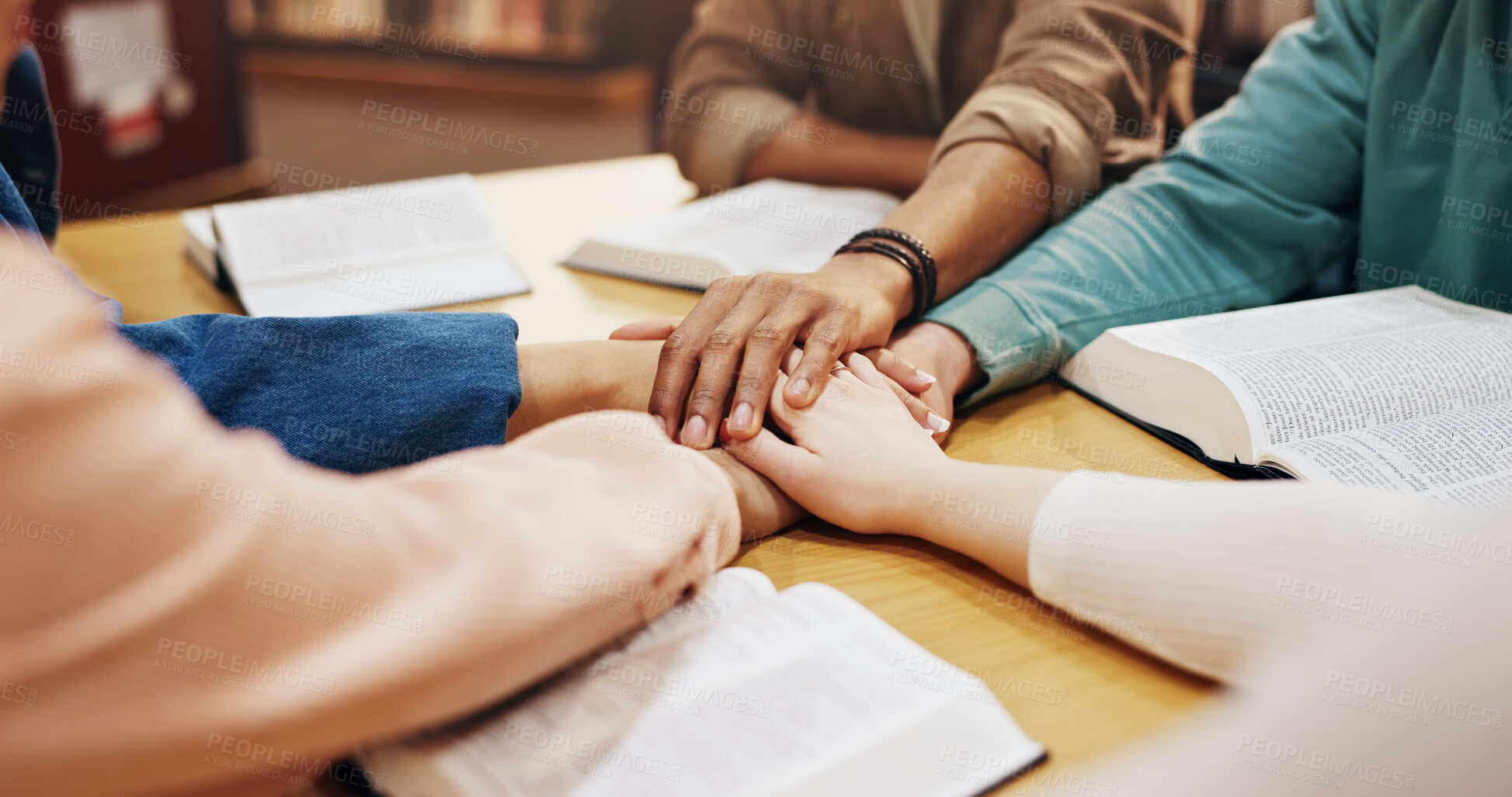 Buy stock photo Table, holding hands and group with faith, praying and friends with belief, Christian and God. Respect, spiritual and circle of people, bible study and worship of holy spirit, guide and learning