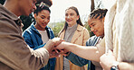 Students, smile and hands stack for teamwork outdoor with education support, learning success and studying. People, friends or collaboration for college future, scholarship and celebration of synergy