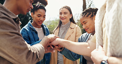 Buy stock photo Students, smile and hands stack for teamwork outdoor with education support, learning success and studying. People, friends or collaboration for college future, scholarship and celebration of synergy