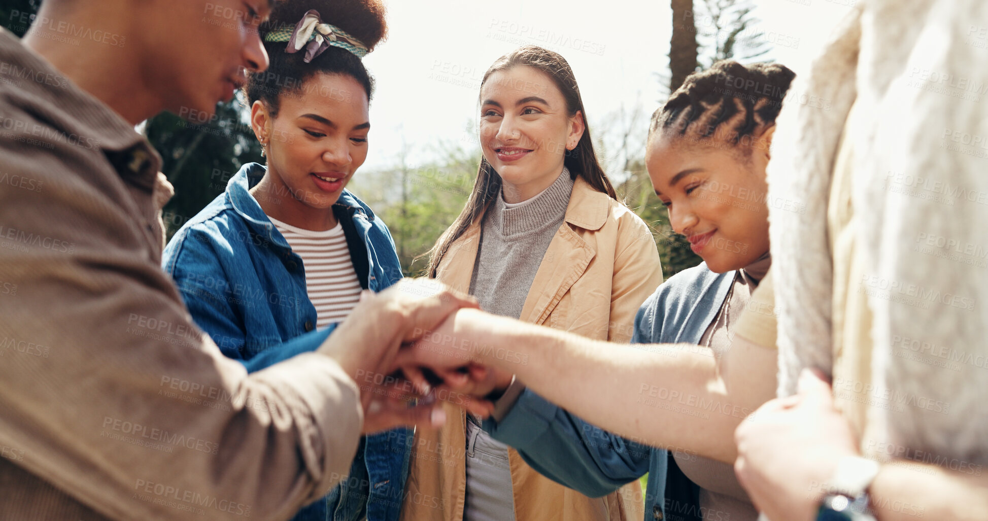 Buy stock photo Students, smile and hands stack for teamwork outdoor with education support, learning success and studying. People, friends or collaboration for college future, scholarship and celebration of synergy