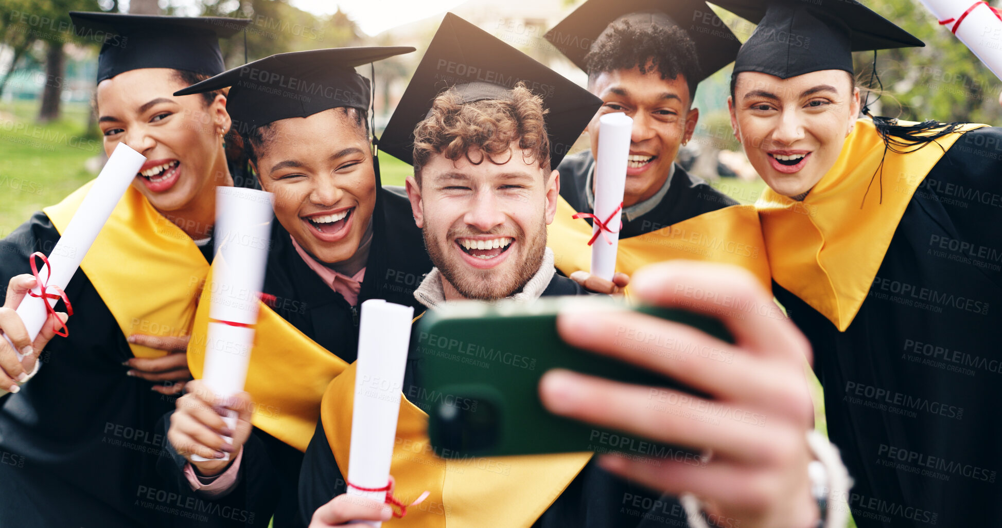 Buy stock photo Selfie, happy and friends at college graduation with degree certificate for education achievement. Excited, diploma and group of students with photography picture for memory of university goals.