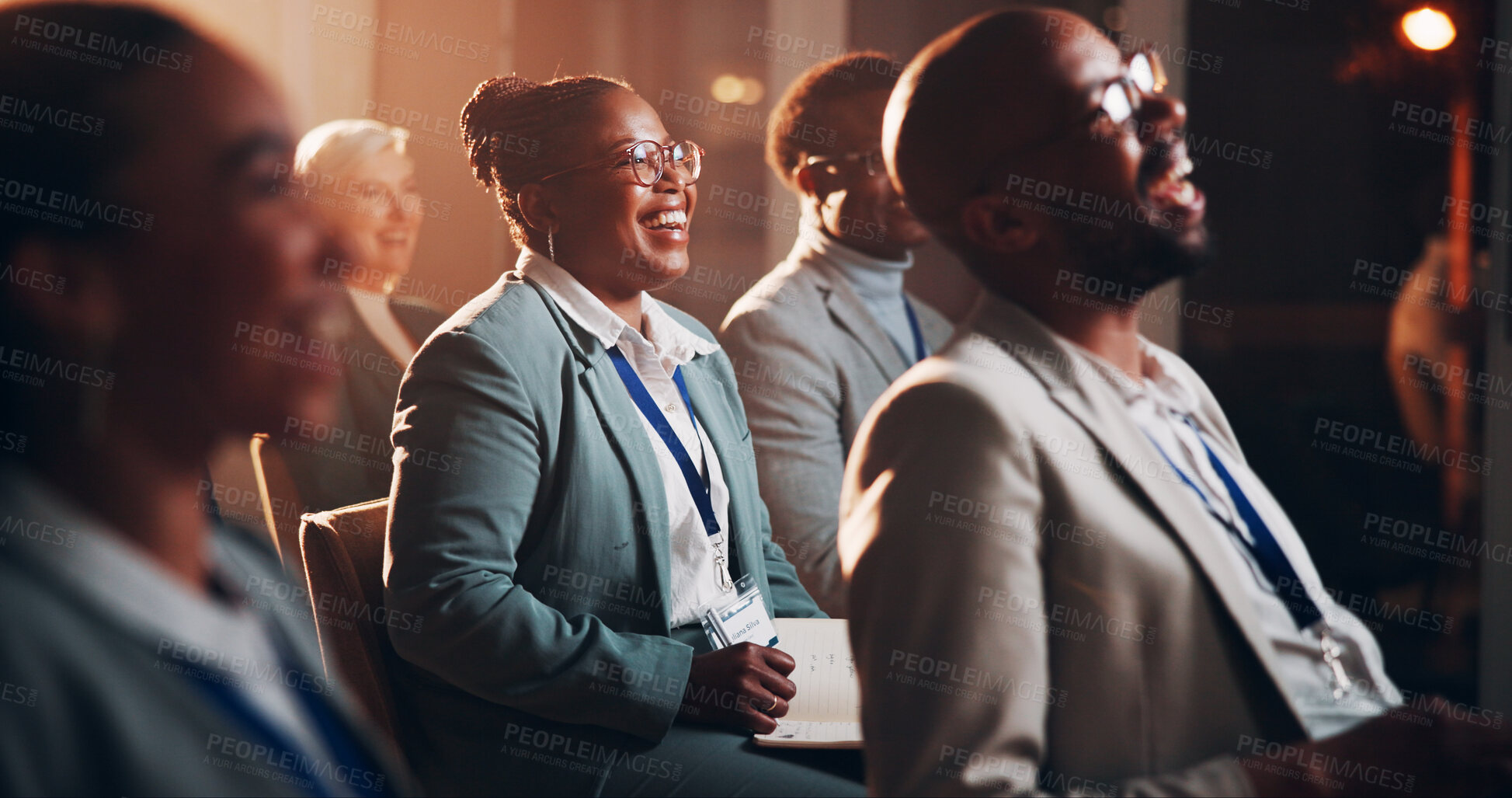 Buy stock photo Business, woman and writing at meeting seminar for notes, listening and corporate training of speech. Person, crowd and laugh of presentation joke, learning information and coaching feedback at event