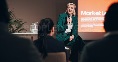 Buy stock photo Mature woman, stage and seminar with microphone for leadership skills, information or knowledge. Female person, public speaker and presentation at global summit, conference or motivation in uplifting