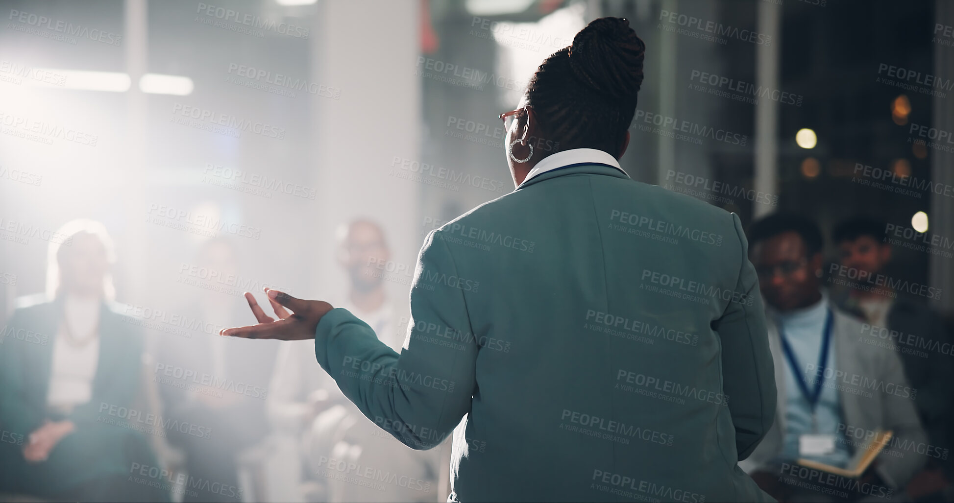 Buy stock photo Back, speaker and woman with presentation for crowd speech, workshop and coaching conference on stage. Professional, presenter and mic for communication, public speaking and lecture of business pitch
