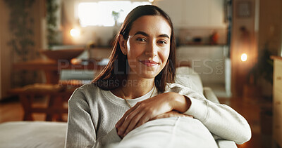 Buy stock photo Woman, smile and relax in home for portrait, comfort and weekend chill in Spain. Girl, happy and positive attitude on sofa for student break, rest and aesthetic in living room for peace and calm