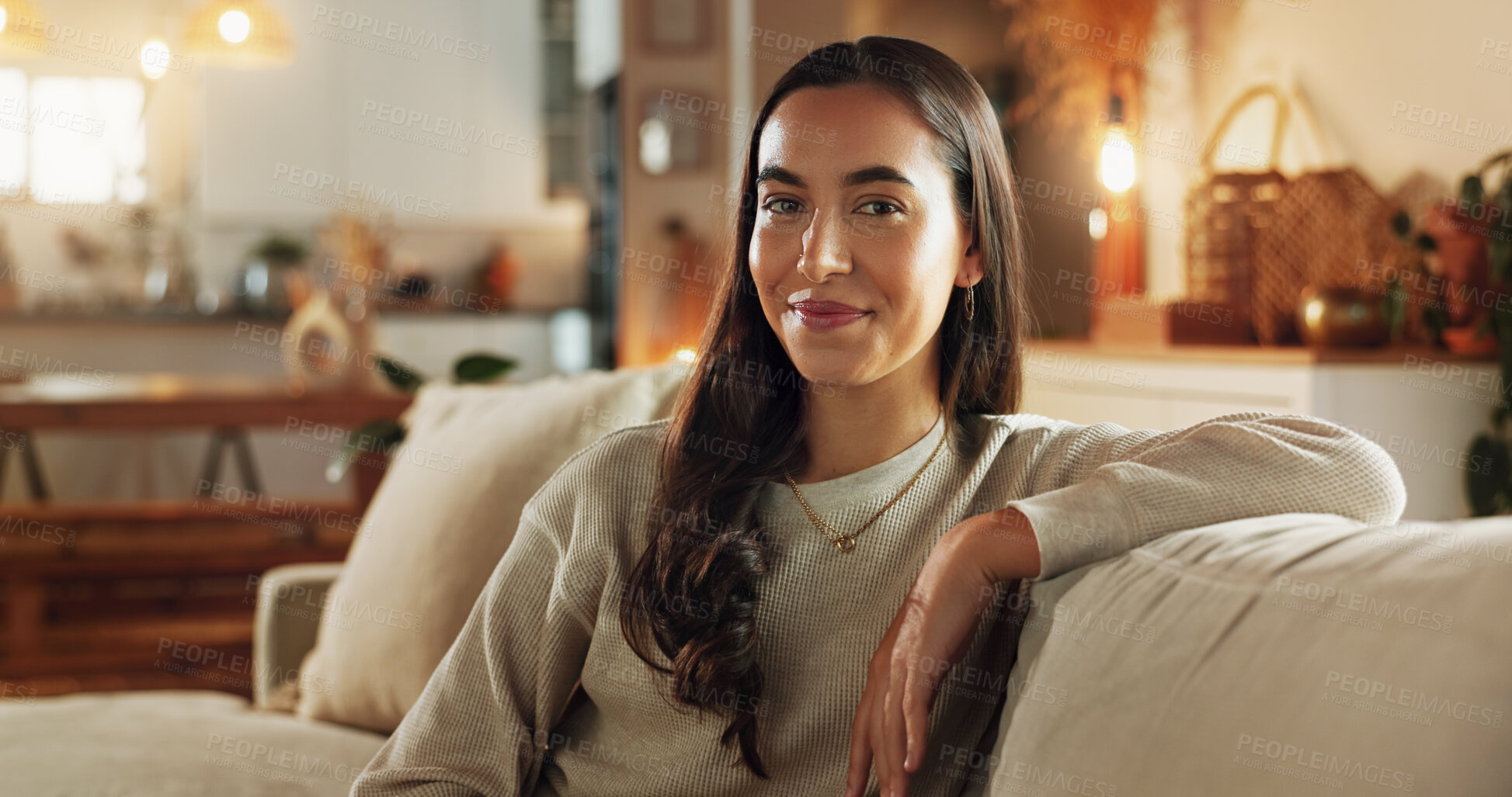 Buy stock photo Woman, happy and relax in home for portrait, comfort and weekend chill in Spain. Girl, smile and positive attitude on sofa for student break, rest and aesthetic in living room for peace and calm